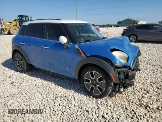 2011 MINI Countryman S with VIN WMWZC5C54BWL53955, listed as a Copart auction lot 52187405 with 124,470 mi miles and Salvage Title. Bid and sale history available at DreamBid. Image 4.