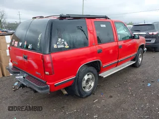 1998 GMC Yukon with VIN 1GKEK13R0WJ703105, listed as a IAAI auction lot 41980869 with 302,546 mi miles. Bid and sale history available at carsss.com. Image 4.