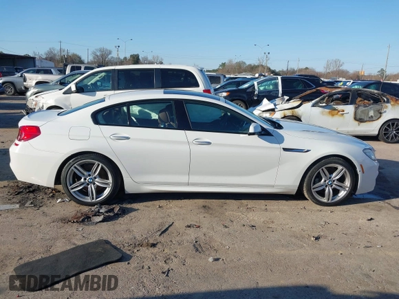 2015 BMW 6 Series 640i xDrive with VIN WBA6B8C50FD453317, listed as a IAAI auction lot 41635430 with 77,811 mi miles and . Bid and sale history available at DreamBid. Image 13.
