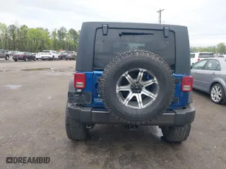 2010 Jeep Wrangler Unlimited Sport with VIN 1J4BA3H11AL144560, listed as a IAAI auction lot 42013032 with 226,233 mi miles. Bid and sale history available at carsss.com. Image 16.