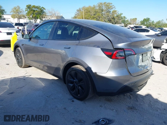 2025 Tesla Model Y Long Range with VIN 7SAYGDED7SA376233, listed as a IAAI auction lot 41777876 with 70 mi miles and . Bid and sale history available at DreamBid. Image 3.