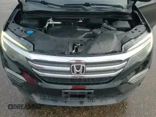 2017 Honda Pilot EX-L z VIN 5FNYF6H71HB067418, wystawiony jako Copart lot #81697595 z przebiegiem 130 461 mil mil oraz Szkoda całkowita • Salvage title. Historia ofert i sprzedaży dostępna na DreamBid. Obrazek 14.