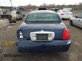 2001 Lincoln Town Car Signature with VIN 1LNHM82W61Y733577, listed as a IAAI auction lot 41899175 with 105,083 mi miles and . Bid and sale history available at DreamBid. Image 16.