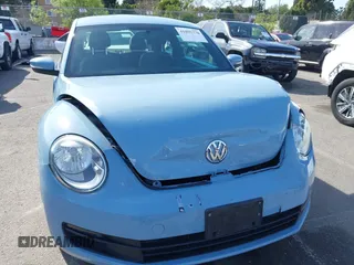 2013 Volkswagen Beetle with VIN 3VWHX7AT4DM667136, listed as a IAAI auction lot 41855778 with 120,300 mi miles and . Bid and sale history available at DreamBid. Image 6.