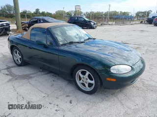 1999 Mazda MX-5 Miata with VIN JM1NB3535X0113442, listed as a IAAI auction lot 41299227 with 100,241 mi miles and . Bid and sale history available at DreamBid. Image 1.