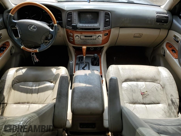 2003 Lexus LX 470 z VIN JTJHT00W733523370, wystawiony jako Copart lot #55516375 z przebiegiem 157 862 mil mil oraz Czysty tytuł • Clean title. Historia ofert i sprzedaży dostępna na DreamBid. Obrazek 8.