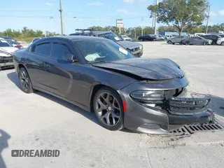 2015 Dodge Charger RT with VIN 2C3CDXCT9FH819971, listed as a IAAI auction lot 40592010 with 154,386 mi miles and . Bid and sale history available at DreamBid. Image 1.