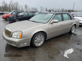 2004 Cadillac DeVille DTS z VIN 1G6KF57944U117834, wystawiony jako Copart lot #89320975 z przebiegiem 149 820 mil mil oraz Szkody całkowita. Historia ofert i sprzedaży dostępna na DreamBid. Obrazek 1.