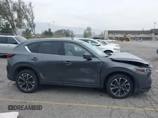 2022 Mazda CX-5 2.5 S Premium Plus Package with VIN JM3KFBEM1N0523105, listed as a IAAI auction lot 41730897 with 64,008 mi miles. Bid and sale history available at carsss.com. Image 13.