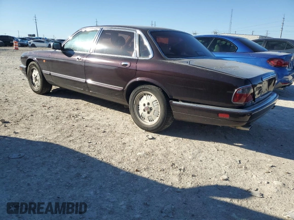 1995 Jaguar XJ with VIN SAJKX1743SC734007, listed as a Copart auction lot 46340825 with 130,115 mi miles and Salvage Title. Bid and sale history available at DreamBid. Image 2.