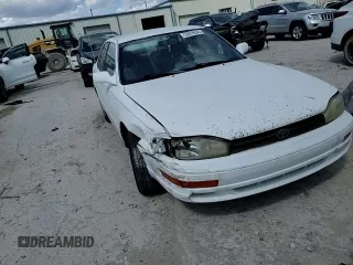 1994 Toyota Camry LE z VIN JT2SK12E0R0256694, wystawiony jako Copart lot #52819245 z przebiegiem 182 566 mil mil oraz Szkoda całkowita • Salvage title. Historia ofert i sprzedaży dostępna na DreamBid. Obrazek 11.