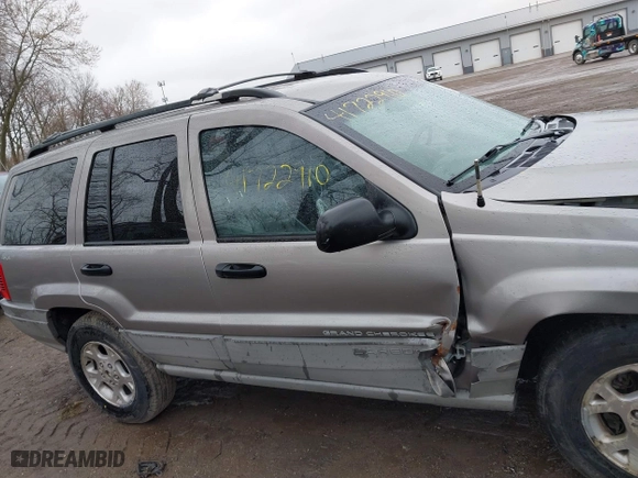 1999 Jeep Grand Cherokee Laredo with VIN 1J4GW58N0XC748809, listed as a IAAI auction lot 41722910 with 201,407 mi miles. Bid and sale history available at carsss.com. Image 13.
