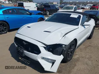 2020 Ford Mustang EcoBoost z VIN 1FATP8UH0L5105965, wystawiony jako IAAI lot #42475841 z przebiegiem 68 999 mil mil oraz . Historia ofert i sprzedaży dostępna na DreamBid. Obrazek 2.