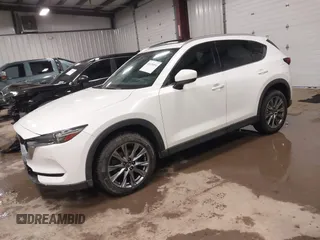 2019 Mazda CX-5 Signature with VIN JM3KFBEY5K0520593, listed as a IAAI auction lot 41638594 with 111,504 mi miles. Bid and sale history available at carsss.com. Image 2.