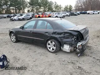 2005 Mercedes-Benz E 5.0L with VIN WDBUF70J45A645154, listed as a Copart auction lot 82883524 with 134,088 mi miles and Salvage Title. Bid and sale history available at carsss.com. Image 2.
