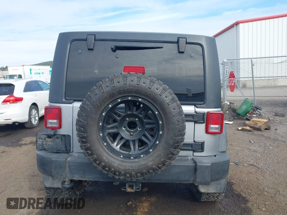 2013 Jeep Wrangler Rubicon 10th Anniversary with VIN 1C4BJWCG8DL639121, listed as a IAAI auction lot 40561773 with 56,023 mi miles and . Bid and sale history available at DreamBid. Image 16.