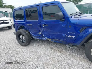 2019 Jeep Wrangler Unlimited Sahara with VIN 1C4HJXEG1KW599117, listed as a IAAI auction lot 42602241 with 109,552 mi miles and . Bid and sale history available at DreamBid. Image 6.