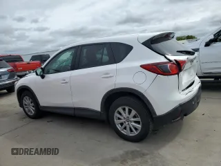 2016 Mazda CX-5 Touring with VIN JM3KE2CYXG0777715, listed as a Copart auction lot 52157005 with 58,585 mi miles and Salvage Title. Bid and sale history available at carsss.com. Image 2.