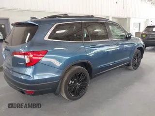 2021 Honda Pilot Special Edition with VIN 5FNYF5H27MB011413, listed as a IAAI auction lot 42082680 with 27,474 mi miles and . Bid and sale history available at carsss.com. Image 4.
