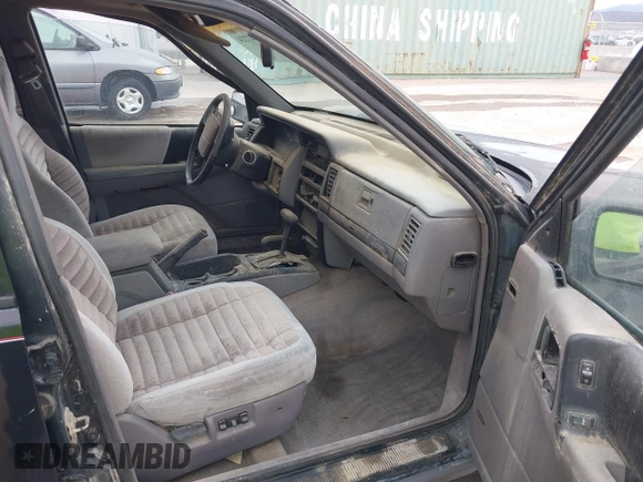 1994 Jeep Grand Cherokee Laredo with VIN 1J4GZ58S2RC118838, listed as a IAAI auction lot 42047224 with 160,715 mi miles. Bid and sale history available at carsss.com. Image 5.