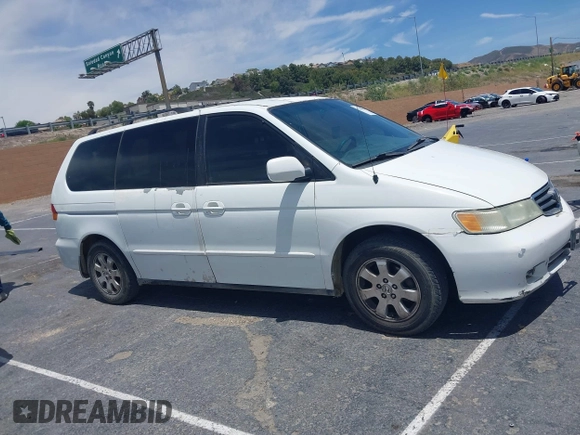 2003 Honda Odyssey EX-L z VIN 5FNRL18033B095684, wystawiony jako IAAI lot #42289617 z przebiegiem 174 336 mil mil oraz . Historia ofert i sprzedaży dostępna na DreamBid. Obrazek 13.