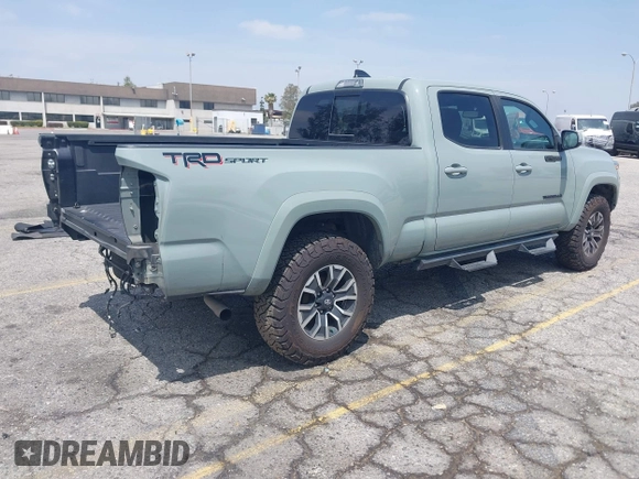 2022 Toyota Tacoma SR5 with VIN 3TMBZ5DN1NM035572, listed as a IAAI auction lot 42083925 with 82,596 mi miles and . Bid and sale history available at DreamBid. Image 4.