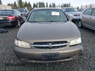1999 Nissan Altima XE with VIN 1N4DL01D1XC210017, listed as a IAAI auction lot 41199544 with 297,917 mi miles. Bid and sale history available at carsss.com. Image 12.