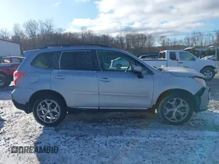 2016 Subaru Forester Touring z VIN JF2SJAXC4GH536085, wystawiony jako IAAI lot #41838081 z przebiegiem 155 930 mil mil oraz . Historia ofert i sprzedaży dostępna na DreamBid. Obrazek 13.