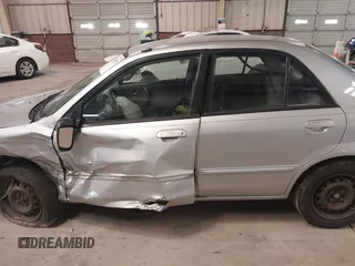 2000 Mazda Protege DX with VIN JM1BJ2226Y0206340, listed as a IAAI auction lot 41645396 with 238,500 mi miles and . Bid and sale history available at DreamBid. Image 14.