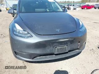 2022 Tesla Model Y Long Range with VIN 7SAYGDEE2NF460945, listed as a IAAI auction lot 41921645 with 62,318 mi miles and . Bid and sale history available at DreamBid. Image 6.
