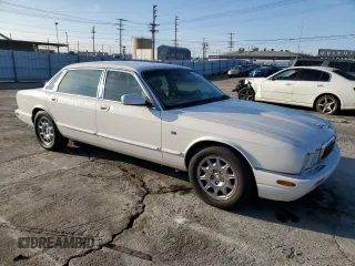 2001 Jaguar XJ with VIN SAJDA23C51LF35586, listed as a Copart auction lot 44105165 with 47,355 mi miles and Salvage title. Bid and sale history available at DreamBid. Image 4.