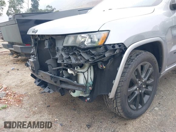 2017 Jeep Grand Cherokee Laredo with VIN 1C4RJEAG0HC702195, listed as a IAAI auction lot 42427597 with 104,403 mi miles and . Bid and sale history available at DreamBid. Image 6.