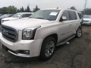 2015 GMC Yukon XL SLT with VIN 1GKS2HKC1FR120133, listed as a IAAI auction lot 39693190 with 211,652 mi miles. Bid and sale history available at carsss.com. Image 2.