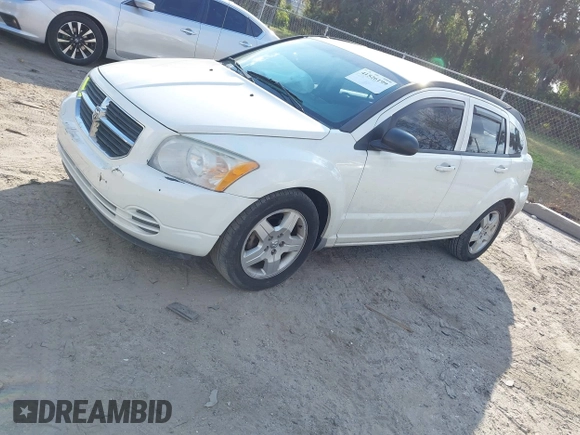 2009 Dodge Caliber SXT with VIN 1B3HB48A69D130857, listed as a IAAI auction lot 41526199 with 163,796 mi miles and . Bid and sale history available at DreamBid. Image 2.