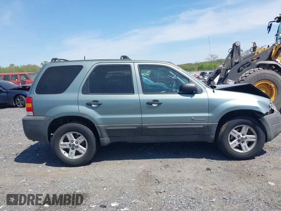 2005 Ford Escape Hybrid z VIN 1FMCU96HX5KC07151, wystawiony jako IAAI lot #42093744 z przebiegiem 275 661 mil mil oraz . Historia ofert i sprzedaży dostępna na DreamBid. Obrazek 14.