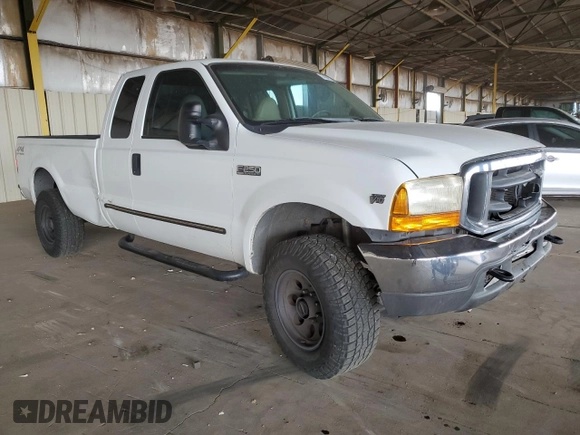 2000 Ford Super Duty F-250 XL with VIN 1FTNX21S9YED03242, listed as a Copart auction lot 74542704 with 218,739 mi miles and Salvage Title. Bid and sale history available at carsss.com. Image 4.