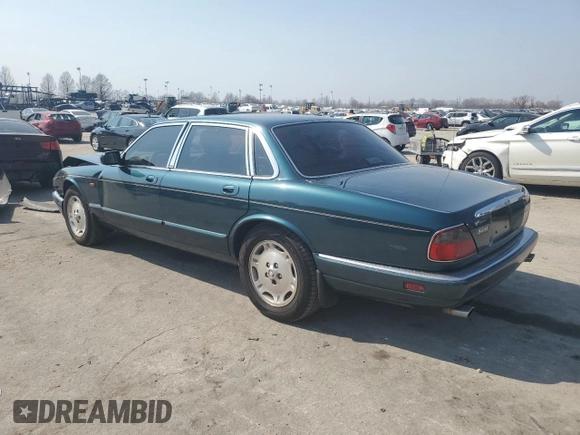 1996 Jaguar XJ z VIN SAJHX1746TC756451, wystawiony jako Copart lot #48991655 z przebiegiem 115 015 mil mil oraz Szkoda całkowita • Salvage title. Historia ofert i sprzedaży dostępna na DreamBid. Obrazek 2.