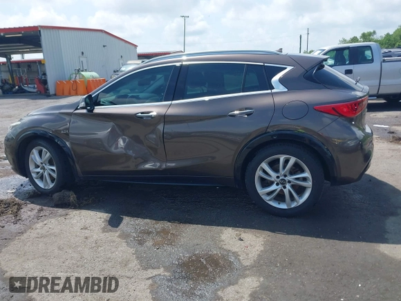 2019 Infiniti QX30 Luxe z VIN SJKCH5CP5KA012022, wystawiony jako IAAI lot #42088799 z przebiegiem 107 381 mil mil oraz . Historia ofert i sprzedaży dostępna na DreamBid. Obrazek 14.