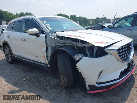 2020 Mazda CX-9 Grand Touring with VIN JM3TCBDY3L0410674, listed as a IAAI auction lot 42389157 with 130,519 mi miles and . Bid and sale history available at DreamBid. Image 1.
