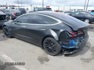 2018 Tesla Model 3 Long Range Battery with VIN 5YJ3E1EA7JF012249, listed as a IAAI auction lot 41782972 with 103,412 mi miles. Bid and sale history available at carsss.com. Image 3.