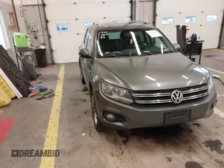 2012 Volkswagen Tiguan SE with VIN WVGBV7AX7CW103623, listed as a IAAI auction lot 41250142 with 82,505 mi miles and . Bid and sale history available at DreamBid. Image 1.