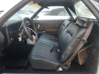 1984 Chevrolet El Camino z VIN 1GCCW80H6ER150486, wystawiony jako Copart lot #76031834 z przebiegiem 77 554 mil mil oraz Szkoda całkowita • Salvage title. Historia ofert i sprzedaży dostępna na DreamBid. Obrazek 7.