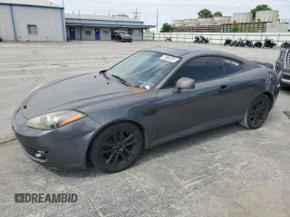 2007 Hyundai Tiburon GS z VIN KMHHM66D47U243846, wystawiony jako Copart lot #57509725 z przebiegiem 181 941 mil mil oraz Szkoda całkowita • Salvage title. Historia ofert i sprzedaży dostępna na DreamBid. Obrazek 1.