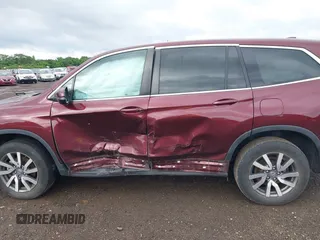 2021 Honda Pilot EX-L with VIN 5FNYF6H53MB094015, listed as a IAAI auction lot 42545722 with 66,065 mi miles and . Bid and sale history available at DreamBid. Image 14.
