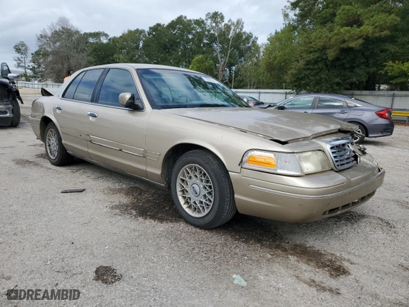 2000 Ford Crown Victoria LX with VIN 2FAFP74W7YX117705, listed as a Copart auction lot 79226944 with 128,019 mi miles and Salvage Title. Bid and sale history available at carsss.com. Image 4.