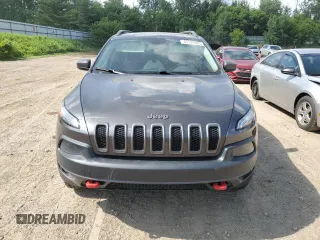 2014 Jeep Cherokee Trailhawk with VIN 1C4PJMBS4EW187085, listed as a Copart auction lot 64106985 with 166,467 mi miles and Clean title. Bid and sale history available at DreamBid. Image 5.