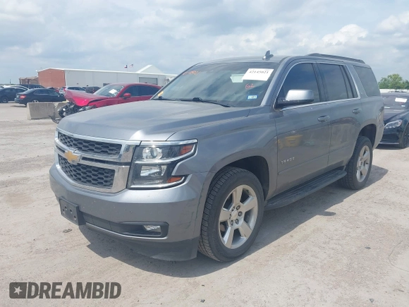 2019 Chevrolet Tahoe LT z VIN 1GNSCBKC8KR406519, wystawiony jako IAAI lot #42145021 z przebiegiem 74 694 mil mil oraz . Historia ofert i sprzedaży dostępna na DreamBid. Obrazek 2.