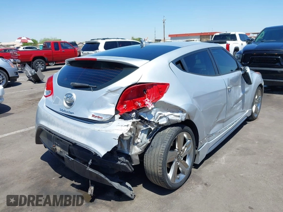 2013 Hyundai Veloster Turbo z VIN KMHTC6AE0DU177983, wystawiony jako IAAI lot #42292102 z przebiegiem 121 142 mil mil oraz . Historia ofert i sprzedaży dostępna na DreamBid. Obrazek 4.