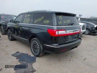 2021 Lincoln Navigator Black Label z VIN 5LMJJ2TT6MEL13834, wystawiony jako IAAI lot #41801640 z przebiegiem 59 843 mil mil oraz . Historia ofert i sprzedaży dostępna na DreamBid. Obrazek 3.