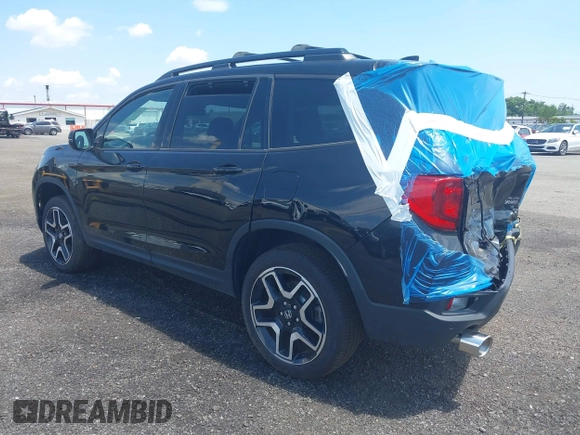 2023 Honda Passport Elite with VIN 5FNYF8H01PB030270, listed as a IAAI auction lot 42667744 with 7,931 mi miles and . Bid and sale history available at DreamBid. Image 3.